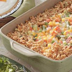 a casserole dish filled with rice and vegetables