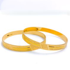 Step out in style with our Striped Machine Cut Bangles. Crafted from 22k gold with a weight of 28.5 grams, these yellow gold bangles are perfect for any occasion. With a bangle size of 2.2 and an opening diameter of 2.15", they are available in a set of 2 pieces. The intricate machine cut stripes on the surface of the bangles are sure to make a statement. PRODUCT DETAILS Gold Purity(karat): 22k Gold Weight(grams): 28.5 Item Finish: Yellow Gold Bangle Size: 2.2 Bangle Opening(diameter): 2.15" Num 22k Gold Round Bangle For Formal Occasions, 22k Gold Bangle For Formal Occasions, Formal 22k Gold Round Bangle, 22k Gold Bangle For Anniversary, 22k Yellow Gold Ceremonial Bangle, 22k Gold Anniversary Bangle, Elegant 22k Yellow Gold Bangle, Festive 22k Yellow Gold Bangle, Formal 22k Gold Hallmarked Bangle