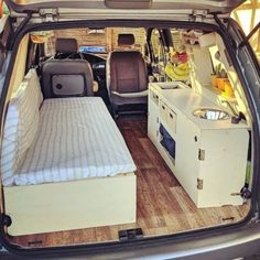 the back end of a van with an open bed