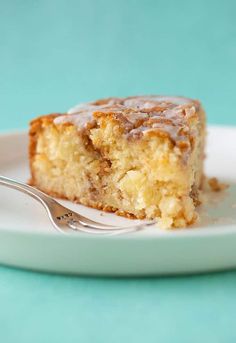 a piece of cake sitting on top of a white plate with a fork in it