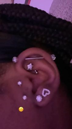 a person with ear piercings on their ears