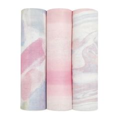 three pink and white napkins are lined up