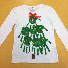 a child's handprinted christmas tree t - shirt