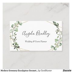 a white business card with greenery on it and the words, wedding & event planner