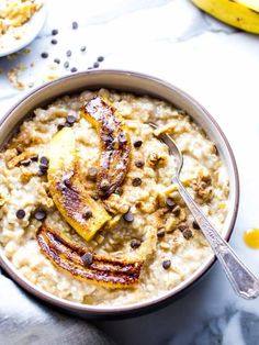 a bowl of oatmeal with bananas and chocolate chips