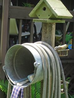 a birdhouse with several hoses attached to it