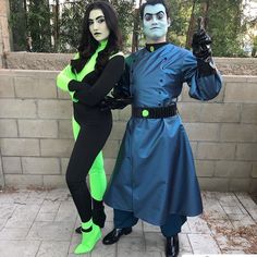 two people in costumes standing next to each other