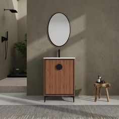 a bathroom with a sink and mirror next to a wooden stool in front of it