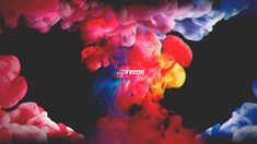 colorful ink is being mixed together with the word supreme in white letters on a black background