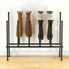 Offering a simple solution to the problem of storing and keeping tall boots crease-free, this 8-pair black metal boot stand stores boots in an inverted position, ensuring boot shafts are kept straight and boots are neatly arranged. Perfect for placement in your entryway, mudroom, closet, or garage, the rack's durable metal construction ensures that this sleek storage rack will last you a lifetime. Size: 10 x 13. Farmhouse Shoe Rack, Boot Shoe Rack, Black Shoe Rack, Mudroom Closet, Shoe Rack Organizer, Boot Rack, Boot Shaper, Boot Stand, Sleek Storage