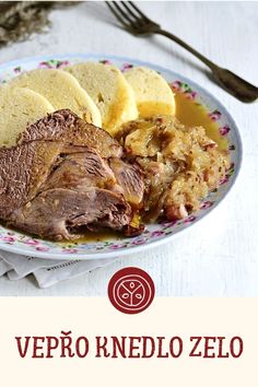 a plate with meat, potatoes and bread on it