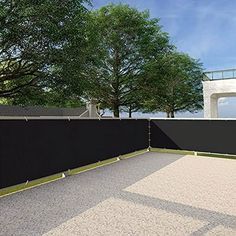 an artist's rendering of a fenced in area with trees on either side