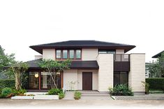 a white house with black roof and windows