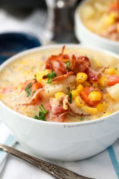 a white bowl filled with corn and bacon soup