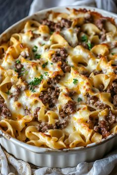 a casserole dish filled with meat and cheese