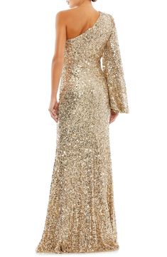 Sparkling sequins and a single blouson sleeve bring glamorous drama to a shoulder-baring gown fashioned with a floor-sweeping hem. 63" length One-shoulder neck Single long sleeve Lined 100% polyester Spot clean Imported Asian Owned/Founded Trumpet Gown, Blouson Sleeve, Sequin Evening Dresses, Bride Groom Dress, Maxi Dress Sale, Sparkle Dress, Asymmetrical Neckline, Mac Duggal, Bishop Sleeve