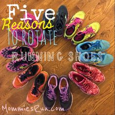 five pairs of running shoes arranged in the middle of a circle on a wooden floor