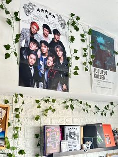 ivy growing up the side of a wall next to bookshelves with posters on them