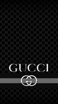 the gucci logo on a black and white wallpaper with silver trimmings