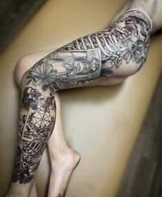 a man with tattoos on his legs and leg