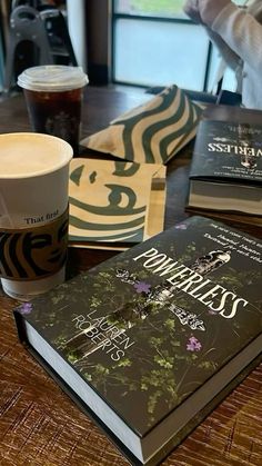 a table topped with books and a cup of coffee