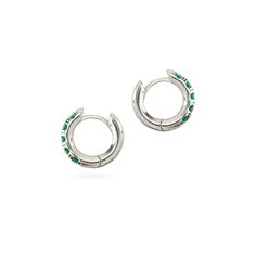 The Eternity Emerald Hoops, a pair of silver hoops featuring emerald accents. Green Cubic Zirconia Tarnish Resistant Jewelry, Green Cubic Zirconia Tarnish-resistant Jewelry, Sterling Silver Gemstone Huggie Earrings, White Gold Hoop Earrings With Gemstones In Sterling Silver, White Gold Sterling Silver Hoop Earrings With Gemstones, Modern Green Cubic Zirconia Jewelry, Classic Sterling Silver Gemstone Hoop Earrings, Silver Sterling Huggie Earrings With Prong Setting, Silver Huggie Earrings With Prong Setting In Sterling Silver