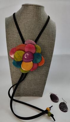 Multicolor Tagua flower pendant necklace & earrings set. Handmade, Eco Friendly, natural tagua jewelry, organic necklace, statement necklace Handmade set of adjustable neacklace and earrings. Handcrafted from tagua seeds from Colombian rainforest. Perfect set for women's special occasion. Gift for her, casual, formal, and dress up. Matching earrings are included. The entire length of the necklace is 18 inches long (46 cm), the pendant lenght is 3 inches (6 cm) and the witdh is 3 inches (8 cm). P Adjustable Multicolor Flower Necklace, Organic Necklace, Tagua Jewelry, Flower Pendant Necklace, Necklace Statement, Romantic Gift, Flower Pendant, Necklace Handmade, Necklace Earring Set