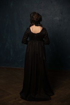 Black satin dress made after late 1790s - early 1800s fashion. Inspired by late Marie-Antoinette round gowns and early Napoleonic dresses. Has one layer of satin fabric (100% cotton) on the bodice and skirt (not lined), which makes it comfortable to wear in summer. The decolette line and Regency waist line has drawstrings to adjust the size to the comfortable one. The dress closes on two drawstrings and a line of hook and eyes on back. It also has front cut to make it easier to adjust the dress Regency Style Medieval Ball Gown, Regency Style Historical Gown For Evening, Elegant Floor-length Victorian Dress For Theater, Regency Style Black Evening Dress, Black Regency Style Evening Dress, Regency Style Gown With Historical Design, Regency Style Empire Waist Evening Gown, Regency Style Medieval Dress With Fitted Bodice, Black Regency Style Victorian Costume Dress