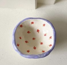 a white and blue bowl sitting on top of a counter