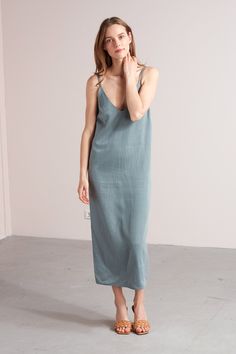 "Hani dress. ✦ EFFORTLESS. CHARMING. CALM. ✦ This slip dress made from extremely soft cupro & cotton fabric will give your summer wardrobe an elegant update. Styling tip for those cooler days: combine with a lightweight jumper or classy blazer. ✅ SIZE & FIT Model is 173 cm/5'7\" and wears size S. XS: Bust - 86 cm / 33,9\", Hips - 94 cm / 37\", Full length - 125 cm / 49,2\" S: Bust - 90 cm / 35,4\", Hips - 98 cm / 38,5\", Full length - 125 cm / 49,2\" M: Bust - 94 cm / 37\", Hips - 102 cm Blue Spring Dresses, Midi Slip Dress, Maxi Slip Dress, Dress Beach, Dinner Dress, Basic Dress, Strap Dress, Beach Dresses, Beach Dress