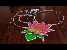 a wooden table topped with a drawing of a flower