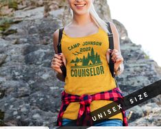 Customize this camp counselor tank top shirt for a summer camp, camping trip for friends or family, or to create fun matching group shirts! FREE SHIPPING All items are made to order and there are no returns on merchandise. Please be sure to double check your order before placement, and see sizing chart and size recommendations to find the best fit for you! This must-have unisex jersey tank top fits like a well-loved favorite. High quality print makes it an ultimate statement shirt for years to c Summer Camp Shirts, Counselor Shirt, Camp Shirts, Camping Shirts, Camp Counselor, Group Shirts, Statement Shirt, Comfy Sweaters, Camping Trip