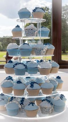 cupcakes are stacked on top of each other in the shape of a tower