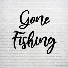 the words gone fishing on a white brick wall