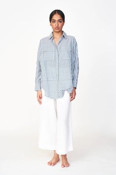 Oversized blouse with front button placket Gathered at back yoke Full length sleeves tapered at cuff with button closure Patch pockets on chest with button flaps Semi sheer 100% cotton Made in India Daywear Shirt With Buttoned Pockets And Shirttail Hem, Classic Cotton Blouse With Buttoned Pockets, Oversized Blouse With Roll-up Sleeves And Spread Collar, Button-up Office Blouse With Buttoned Pockets, Office Button-up Blouse With Buttoned Pockets, Daywear Shirt With Buttoned Pockets And Spread Collar, Daytime Shirt With Buttoned Pockets And Spread Collar, Collared Office Blouse With Buttoned Pockets, Office Collared Blouse With Buttoned Pockets