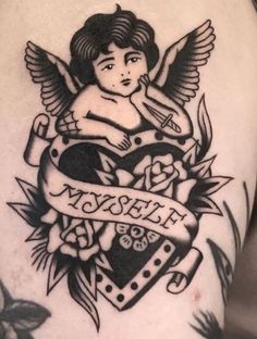 an angel tattoo on the back of a woman's arm with a heart and banner