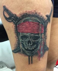 a skull with a red bandana on it's head is shown in this tattoo