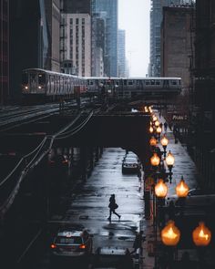 a person walking down a street in the rain