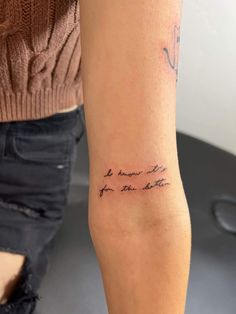 a woman with a tattoo on her arm that says, be brave for the future