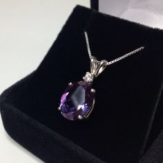 "Beautiful Alexandrite & White Sapphire Pendant Necklace * 5ct Oval Cut Alexandrite * Brilliant Cut White Sapphire Accent * 16\" or 18\" Sterling Silver Chain - Select your length * Solid Sterling Silver Hallmarked & Gift Ready! Matching Earrings and/or Ring Available This Alexandrite is Laboratory Grown. The color changes in this stone range from deep purple to fuchsia to a iridescent blue green lavender mix depending on the level & type of light it is exposed to. It is optically id Alexandrite Necklace, Sapphire Necklace Pendants, Fine Art Jewelry, Sapphire Pendant, Sterling Silver Necklace Pendants, White Sapphire, Silver Pendant Necklace, Jewelry Trends, Sterling Silver Pendant