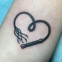 a heart shaped tattoo with a snake wrapped around it