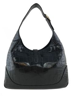 We the ity of this stunning, extremely rare Gucci Crocodile Jackie O Hobo Bag in black. Featuring a single, adjustable looping shoulder strap and gold-tone hardware, including a signature logo-engraved piston press-lock closure. The roomy interior is finely lined in buttery-soft black leather with zip and two patch pockets. Condition: Pristine. Brand new with No visible wear. Black crocodile Leather shoulder strap, 12'' drop Gold-tone hardware Piston lock closure Leather lining Inside,two compar Timeless Crocodile Pattern Bags, Timeless Black Hobo Bag For Business, Modern Crocodile Pattern Formal Shoulder Bag, Modern Black Crocodile Pattern Shoulder Bag, Modern Formal Shoulder Bag With Crocodile Pattern, Modern Black Shoulder Bag With Crocodile Pattern, Luxury Crocodile Pattern Shoulder Bag For Formal Events, Luxury Crocodile Pattern Shoulder Bag For Formal Occasions, Designer Shoulder Bag With Crocodile Pattern For Formal Occasions