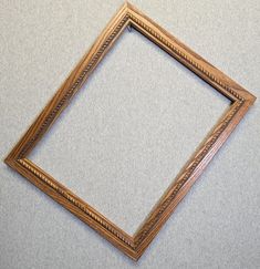 an empty wooden frame on the floor