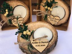 three wooden slices with candles in them on a table