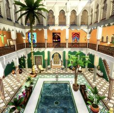 an indoor pool in the middle of a building with potted plants on either side