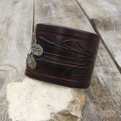 Made from top quality Italian vegetable tanned leather.Hand dyed and embossed with bronze butterfly.Cuff is 2" (5 cm) widePlease measure carefully your wrist and select the most preferable size!If you need a diferent size, please let me know after purchase in "note for seller".Please visit to my another shop:https://www.etsy.com/shop/JeansBelt?ref=hdr_shop_menu**************************************************************************FEDEX to USA and Australia!If you need a faster shipping please Vintage Hand Tooled Cuff Bracelet For Festivals, Vintage Hand-tooled Cuff Bracelet For Festivals, Rustic Cuff Bracelet For Festivals, Brown Stamped Bohemian Cuff Bracelet, Bohemian Brown Cuff Bracelet With Patina, Bohemian Stamped Brown Cuff Bracelet, Brown Bohemian Stamped Cuff Bracelet, Hand Tooled Cuff Bracelet For Festival, Festival Hand Tooled Cuff Bracelet