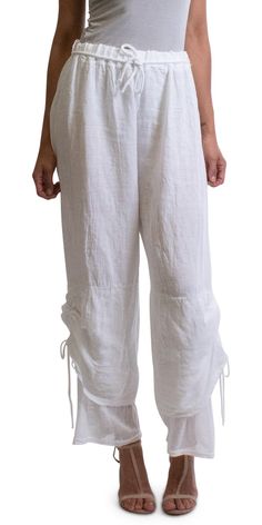 This elegant and casual linen tie & waist pant has a side tie at the legs and fishnet details on the bottoms for added style. 80% Linen, 20% Cotton One Size Fits the Most Made in Italy Model is 5'8'' Model is also wearing our Calandra Linen Kaftan in Navy. Linen Kaftan, Elegant Pants, Elegant Pant, Tie Waist Pants, Summer Wardrobe Essentials, Ruffle Pants, Linen Clothes, Linen Pants, Black Silk