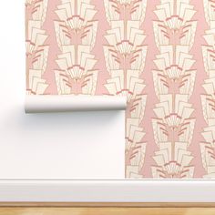 a pink wallpaper with an art deco style pattern on the wall next to a white door