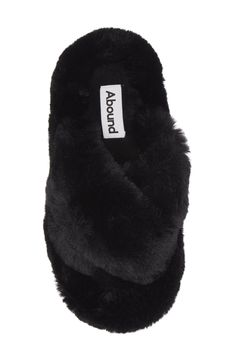 Plush faux fur straps and a footbed envelop your feet in comfort, allowing you to lounge in style. Polyester faux fur upper and lining/rubber sole Imported Black Synthetic Slippers With Faux Fur Lining, Black Slippers With Faux Fur Lining, Black Faux Fur Slippers With Round Toe, Black Faux Fur Slippers For Winter, Black Soft Synthetic Slippers, Soft Black Synthetic Slippers, Black Plush Lined Winter Slippers, Comfortable Black Slippers With Faux Fur Lining, Soft Black Winter Slippers