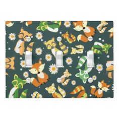 an animal themed light switch plate cover with flowers and cats on the wall behind it